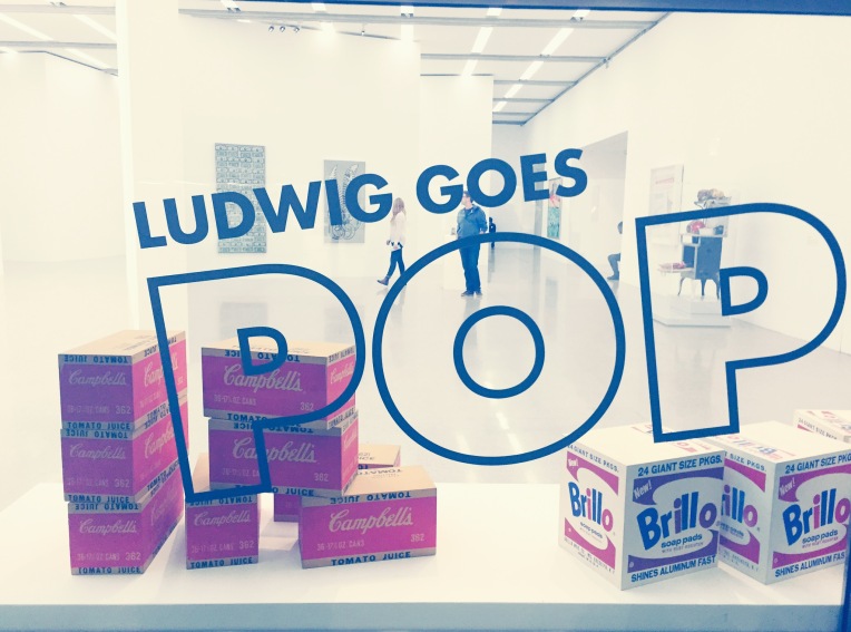 Entrance to 'Ludwig Goes Pop' at mumok, Vienna. Note Andy Warhol's 'White Brillo Boxes'  (1964) and 'Campbell's Boxes' (1964) through the glass.